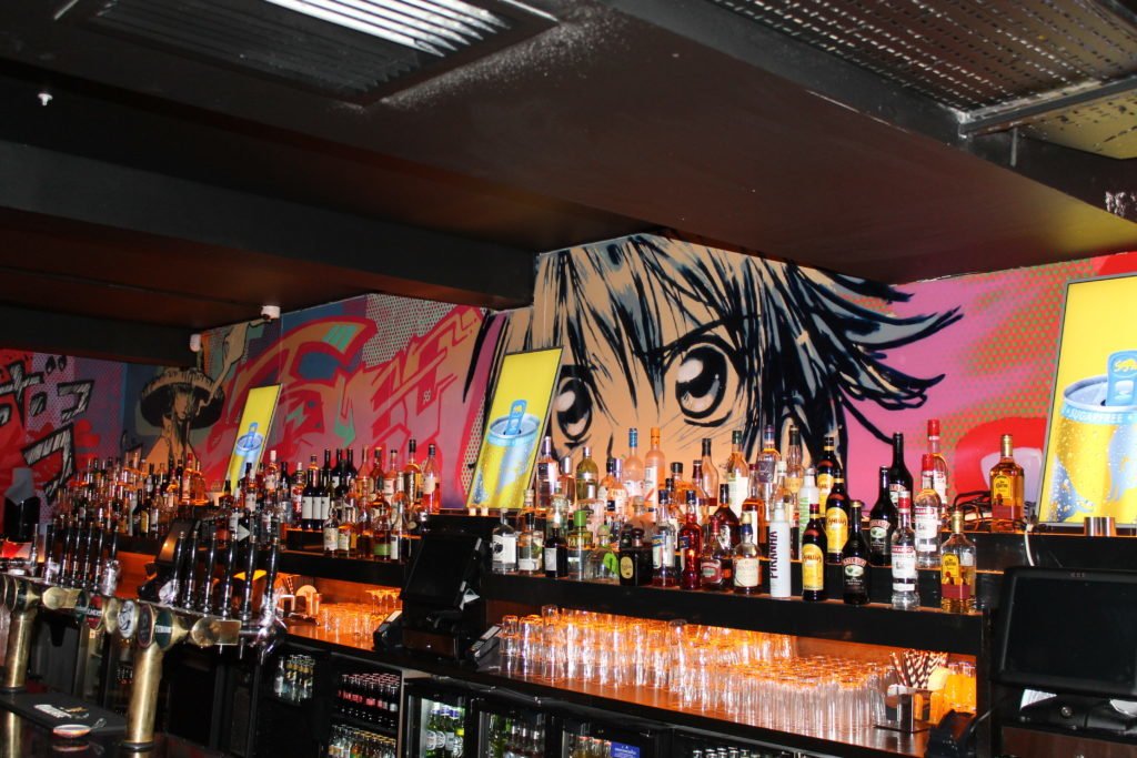 manga style mural painted in Opium Rooms
